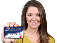 Young woman holding a Debit Mastercard from First National Bank