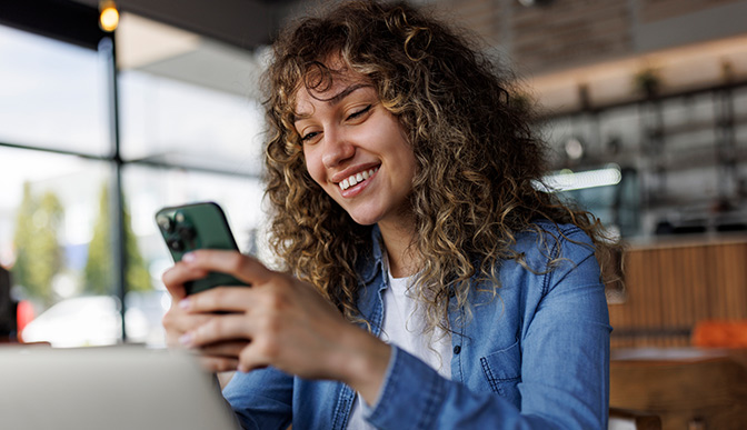 Person transferring money with their phone.