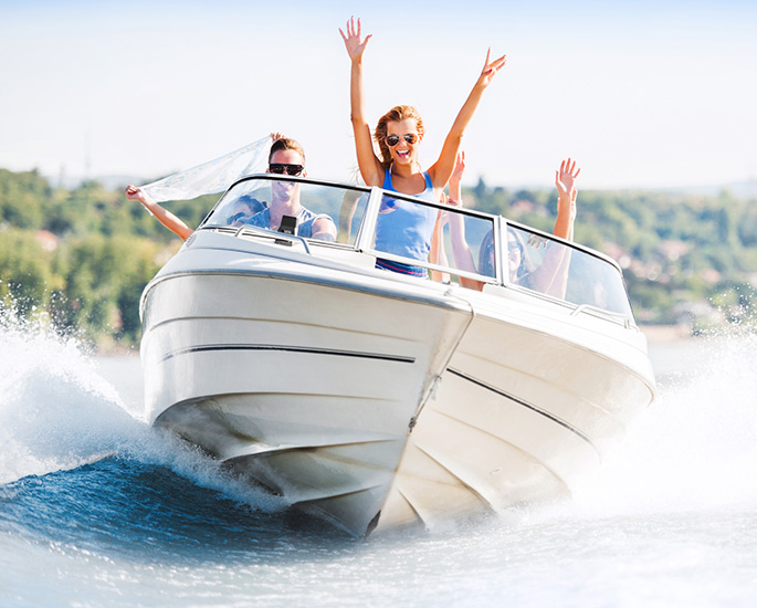 Family enjoying their boat on the lake.