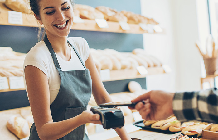Person paying bill with their phone.